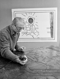 Roy Lichtenstein using Dremel tool onwoodcut for his 'Reflections on the Scream'. Tyler Graphics Studio, Mt. Kisco, NY. 1989. photo:©Bob Adelman Estate, Artwork©Estate of Roy Lichtenstein