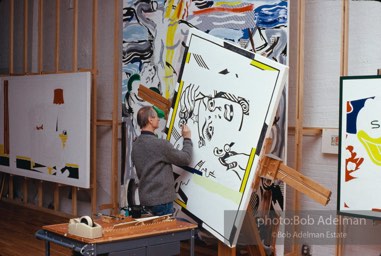 Roy Lichtenstein at work on his painting 'Reflections:Wonder Woman- (Laocoon and Portrait of a Duck in background). 1989. photo:©Bob Adelman Estate, Artwork©Estate of Roy Lichtenstein