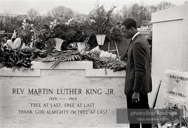 King’s tombstone on view near Morehouse College, Atlanta 1968. King’s tombstone was placed on view on the grounds of Morehouse College at the time of the memorial service.
It was subsequently placed over his grave at South View Cemetery in Atlanta, then moved in 1977 when King’s remains were re-interred at the Martin Luther King, Jr. National Historic Site near downtown Atlanta. King’s tombstone on view near Morehouse College, Atlanta 1968. King’s tombstone was placed on view on the grounds of Morehouse College at the time of the memorial service.
It was subsequently placed over his grave at South View Cemetery in Atlanta, then moved in 1977 when King’s remains were re-interred at the Martin Luther King, Jr. National Historic Site near downtown Atlanta.