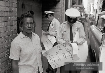 Woman being arrested for picketing at Loveman’s department store, Birmingham 1963
This protestor was picketing the lunch counter at Loveman’s department store. Her sign is a powerful
indictment of the denial of basic rights to blacks. Woman being arrested for picketing at Loveman’s department store, Birmingham 1963
This protestor was picketing the lunch counter at Loveman’s department store. Her sign is a powerful
indictment of the denial of basic rights to blacks.