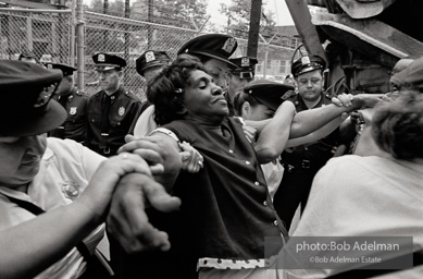 A demonstrator protesting unfair hiring practices is arrested at a construction site. Downstate Medical Center, Brooklyn, New York. 1963.