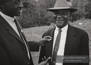 Ronnie Moore pinning Rev. Carter with registration button, St. Francisville,
West Feliciana, LA 1963 Ronnie Moore pinning Rev. Carter with registration button, St. Francisville,
West Feliciana, LA 1963