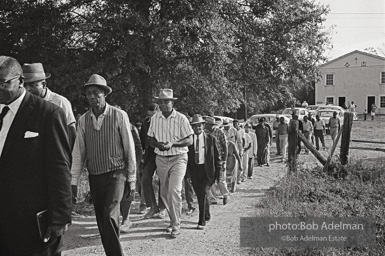 Line of men on the way to the West Feliciana Parish courthouse in St. Francisville, Louisiana to register to vote 1963. Line of men on the way to the West Feliciana Parish courthouse in St. Francisville, Louisiana to register to vote 1963.