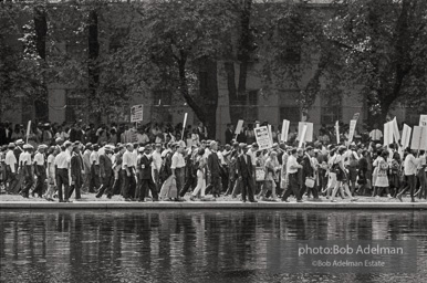 Crowd moving along the Reflecting Pool, Washington DC 1963. After songs and speeches at the Washington Monument, marchers walked down the Reflecting Pool to the base of the Lincoln Memorial. March leaders had been meeting with congressional leaders at the Capitol and had to hurry to catch up to the advancing marchers. Crowd moving along the Reflecting Pool, Washington DC 1963. After songs and speeches at the Washington Monument, marchers walked down the Reflecting Pool to the base of the Lincoln Memorial. March leaders had been meeting with congressional leaders at the Capitol and had to hurry to catch up to the advancing marchers.