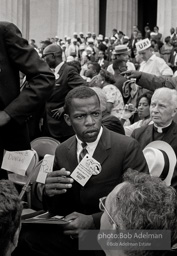 John Lewis chairman of SNCC arrises to address the March. All of 22 at the time he had just returned from having his militant speach severly edited by his elders.