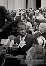 John Lewis chairman of SNCC arrises to address the March. All of 22 at the time he had just returned from having his militant speach severly edited by his elders. John Lewis chairman of SNCC arrises to address the March. All of 22 at the time he had just returned from having his militant speach severly edited by his elders.