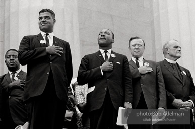 Leaders including the Reverend Ralph Abernathy (far left), National Urban League Director Whitney Young Jr. (left), and Walter Reuther head of the CIO (right) Jjoin King to pledge allegiance at the beginning of the ceremony at the Lincoln Memorial, Washington D.C. August 28, 1963 Leaders including the Reverend Ralph Abernathy (far left), National Urban League Director Whitney Young Jr. (left), and Walter Reuther head of the CIO (right) Jjoin King to pledge allegiance at the beginning of the ceremony at the Lincoln Memorial, Washington D.C. August 28, 1963