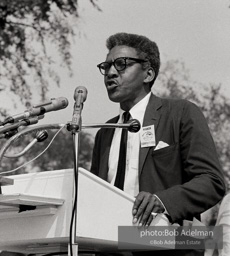 Bayard Rustin organizer of the March on Washington addresses the Marchers assembling at the Washington Monument. August 28, 1963. Bayard Rustin organizer of the March on Washington addresses the Marchers assembling at the Washington Monument. August 28, 1963.