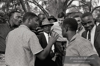 Neighbors and civil rights workers gather to congratulate Carter and hear about his historic breakthrough, West Feliciana Parish, Louisiana.  1964