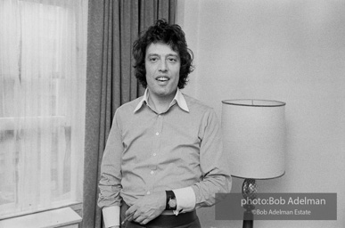 Tom Stoppard at his hotel room in New York City during the Broadway production of his play TRAVESTIES, Ethel Barrymore Theatre, 1976.