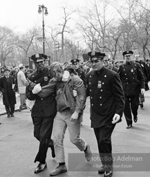 Marchers and onlookers, both for and against the war in Vietnam. Near Central Park in New York City. Marchers and onlookers, both for and against the war in Vietnam. Near Central Park in New York City.