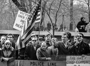 Marchers and onlookers, both for and against the war in Vietnam. Near Central Park in New York City.