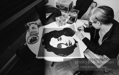 Andy Warhol signs his Liz Taylor prints at the Leo Castelli Gallery. New York City, 1965.