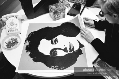 Andy Warhol signs his Liz Taylor prints at the Leo Castelli Gallery. New York City, 1965. Andy Warhol signs his Liz Taylor prints at the Leo Castelli Gallery. New York City, 1965.