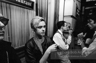 Andy Warhol and  entourage late at night outside a NYC night club, 1865