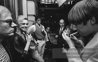 Andy Warhol and  entourage late at night outside a NYC night club, 1865