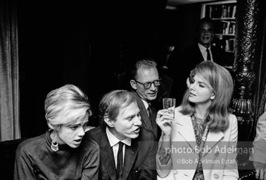 Edie Sedgwick and Andy Warhol with unidentified guest at a society party. New York City, 1965.