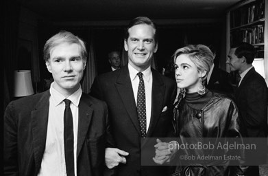 Andy Warhol and Edie Sedgwick with an unidentified guest at a society party. New York City, 1965.