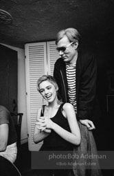 Andy Warhol and Edie Sedgwick at an east-side dinner party. New York City, 1965.