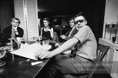 Andy Warhol and Edie Sedgwick with unidentified guests at an east-side dinner party. New York City, 1965.