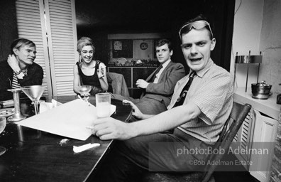 Andy Warhol and Edie Sedgwick with unidentified guests at an east-side dinner party. New York City, 1965.