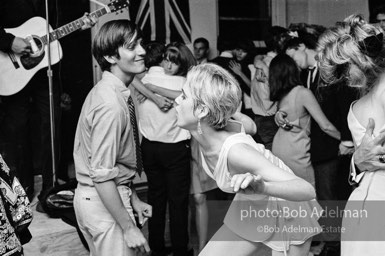 Gino Piserchio and Edie Sedgwick dance at a party. New York City, 1965.