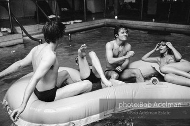 left to right: Chuck Wein, Edie Sedgwick, Gerard Melanga, unidentified. Pool party at Al Roon's gym. New York City, 1965.