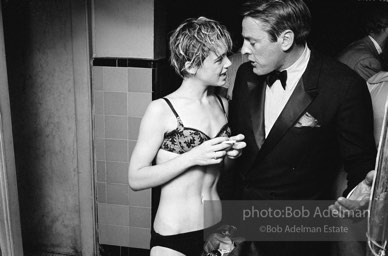 Movie star, Kevin McCarthy with Edie Sedgwick at a pool party at Al Roon's gym, New York City, 1965.