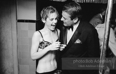 Movie star, Kevin McCarthy with Edie Sedgwick at a pool party at Al Roon's gym, New York City, 1965.