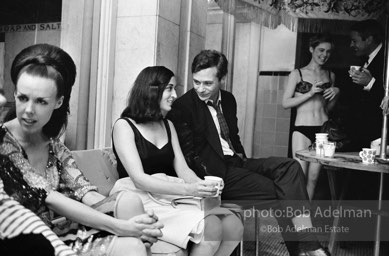 Isabel Nash Eberstadt (left), Marisol, (center), Edie Sedgwick and Kevin McCarthy  in back. Pool party at Al Roon's gym. New York City, 1965.