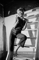 Edie Sedgwick on the steps leading
to Billy Name’s sleeping quarters
at the Factory. 1965.