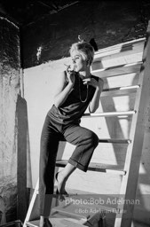 Edie Sedgwick on the steps leading
to Billy Name’s sleeping quarters
at the Factory. 1965.