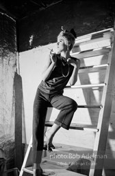 Edie Sedgwick on the steps leading
to Billy Name’s sleeping quarters
at the Factory. 1965.