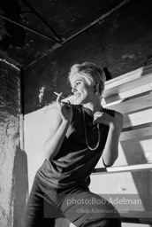 Edie Sedgwick on the steps leading
to Billy Name’s sleeping quarters
at the Factory. 1965.