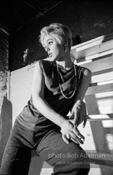 Edie Sedgwick on the steps leading
to Billy Name’s sleeping quarters
at the Factory. 1965.