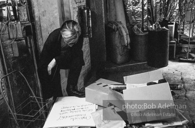 Andy by the Factory payphone reading a message from Gerard Malanga: Chuck is in the recreation room at the “Y”. Bill Schip lost his keys – wants to use ones
you have, Gerry. If any calls for me, I’m at Henry’s. The Factory, 1965.