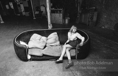 Bibbe Hanson on the red couch at Andy Warhol's Silver Factory, New York City, 1965.
