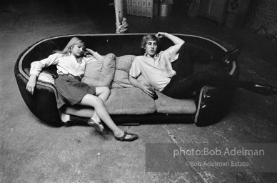 Bibbe Hanson and Chuck Wein on the infamous red couch at Warhol's Factory. New York City, 1965.