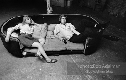 Bibbe Hanson and Chuck Wein on the infamous red couch at Warhol's Factory. New York City, 1965.