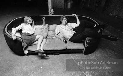 Bibbe Hanson and Chuck Wein on the infamous red couch at Warhol's Factory. New York City, 1965.