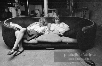 Bibbe Hanson and Chuck Wein on the infamous red couch at Warhol's Factory. New York City, 1965.