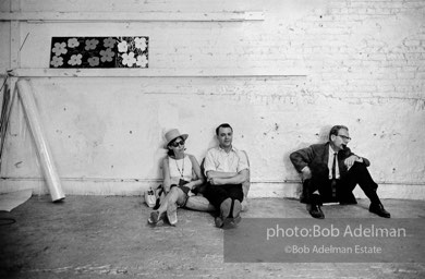 (sitting, center) British journalist John Wilcock, then news editor at the Village Voice.. The Factory, 1965.