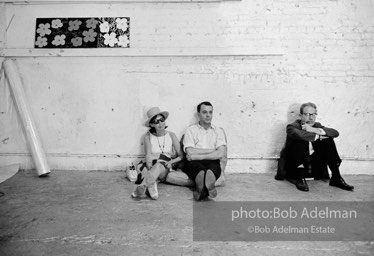 (sitting, center) British journalist John Wilcock, then news editor at the Village Voice.. The Factory, 1965.