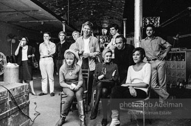 Film screening at the Factory. Standing, left to right: Unknown, Unknown, Chuck Wein, Andy Warhol, Unknown, Stephen Shore, Unknown, Unknown. Sitting, left to right: Bibbe Hansen, Edie
Sedgwick, Pat Hartley. The Factory, 1965.