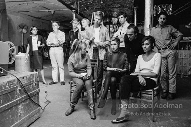 Film screening at the Factory. Standing, left to right: Unknown, Unknown, Chuck Wein, Andy Warhol, Unknown, Stephen Shore, Unknown, Unknown. Sitting, left to right: Bibbe Hansen, Edie
Sedgwick, Pat Hartley. The Factory, 1965.