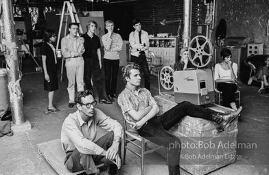 Watching a screeing of a film at the Factory, 1965.