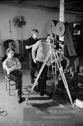 left to right: Gerard Melanga (seated) , Chuck Wein, Andy Warhol and Buddy
Wirtschafter during the filming
of Prison (aka Girls In Prison). The Factory, 1965.