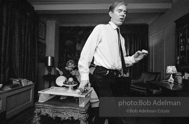 Andy Warhol while preparing the set in a New York City apartment for the film Beauty #2. 1965.