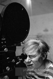 Andy Warhol behind the camera during the filming of 