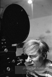 Andy Warhol behind the camera during the filming of 